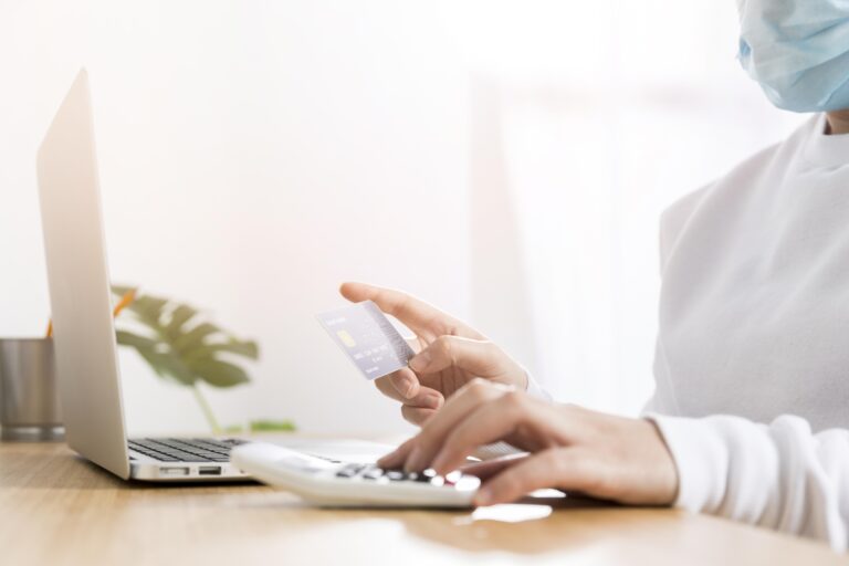 Business owner reviewing open banking payments UK dashboard on tablet showing instant payment confirmation