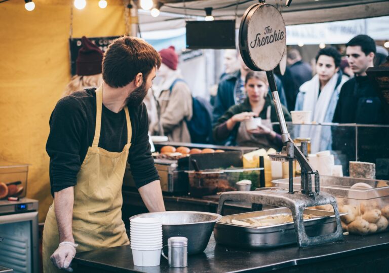 Small UK food stall using a modern card machine for small business payments
