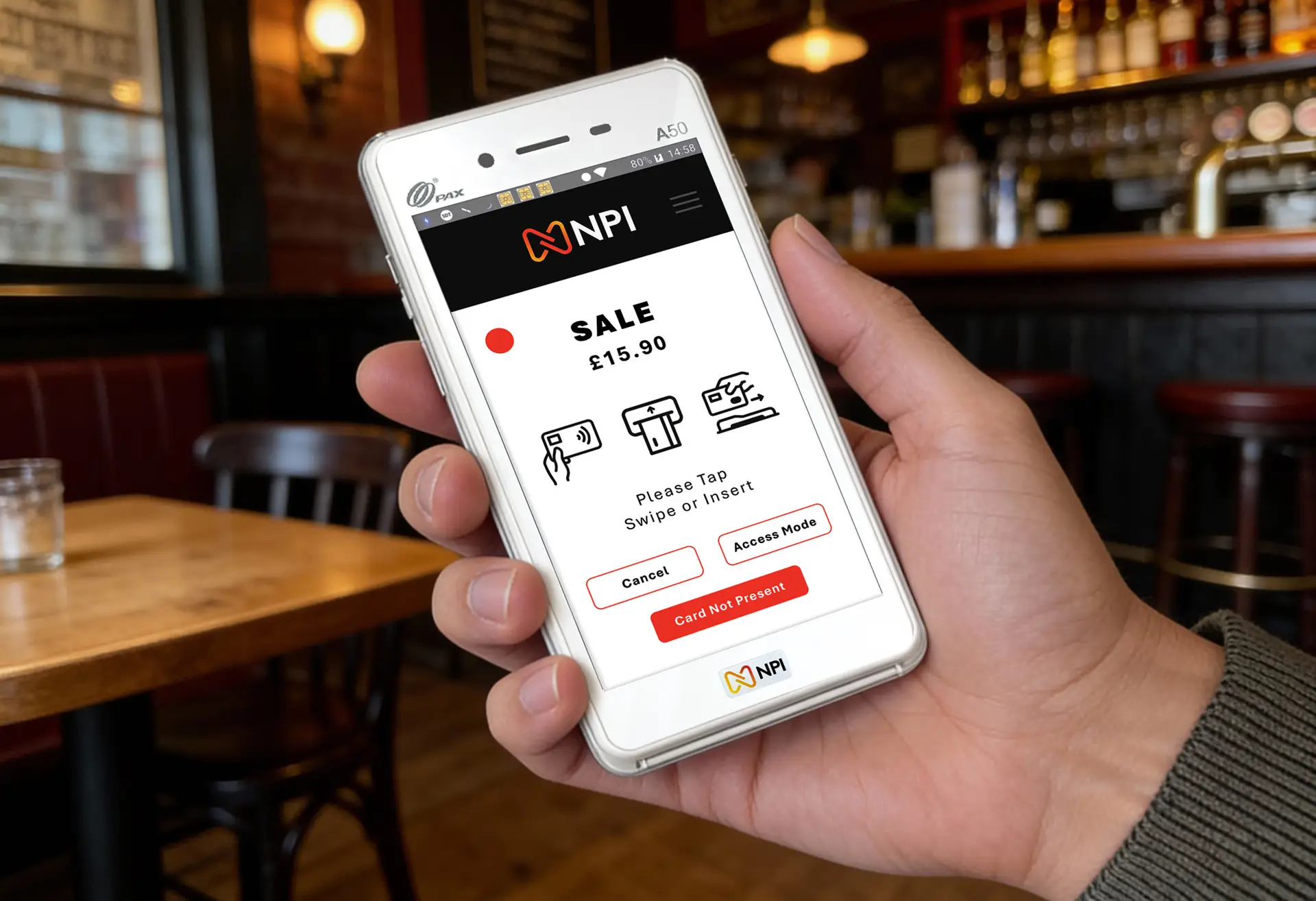 Waiter holding a PAX A50 portable card machine taking a restaurant table payment